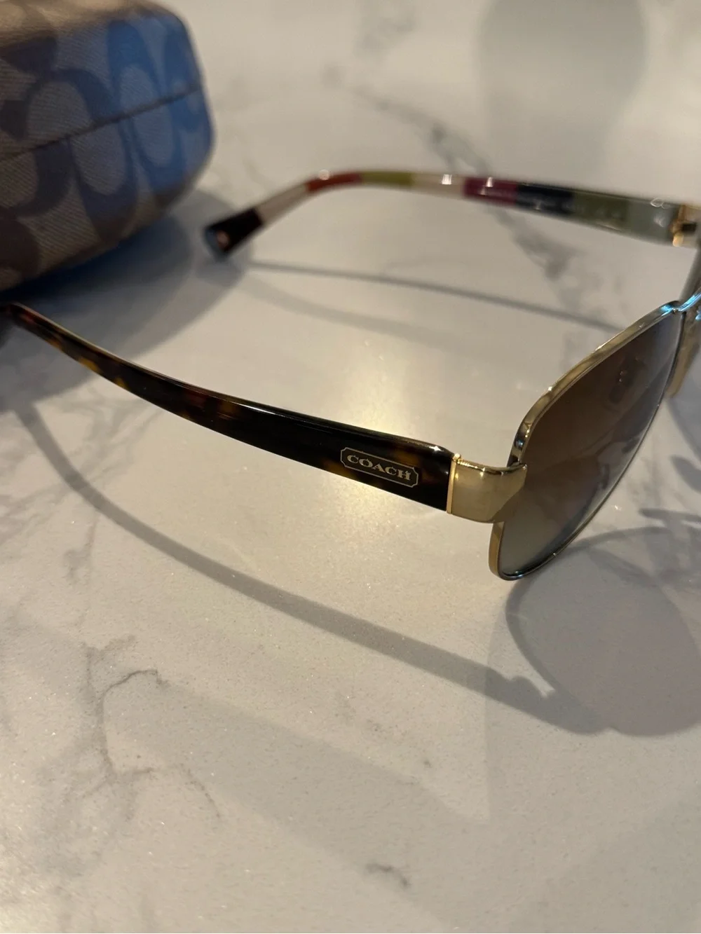 Coach Kristina HC7003 Aviator Gold Frame Sunglasses with Brown Gradient Lenses